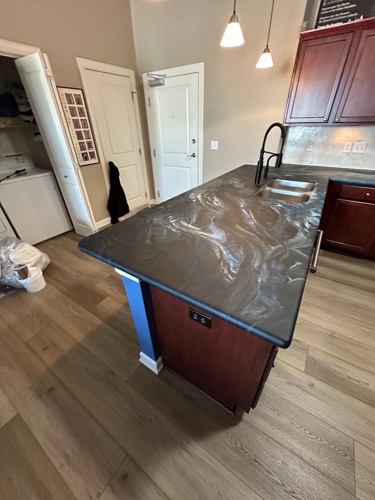 Dark swirl resin stone countertop island transformation Houston TX